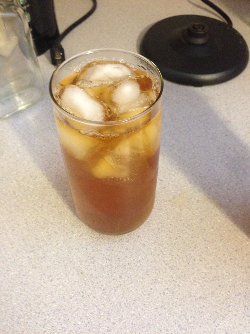 The tea is looking good, but we aren't finished. After 1 min, most of the ice is gone, so we need to pour it back in the original cup.