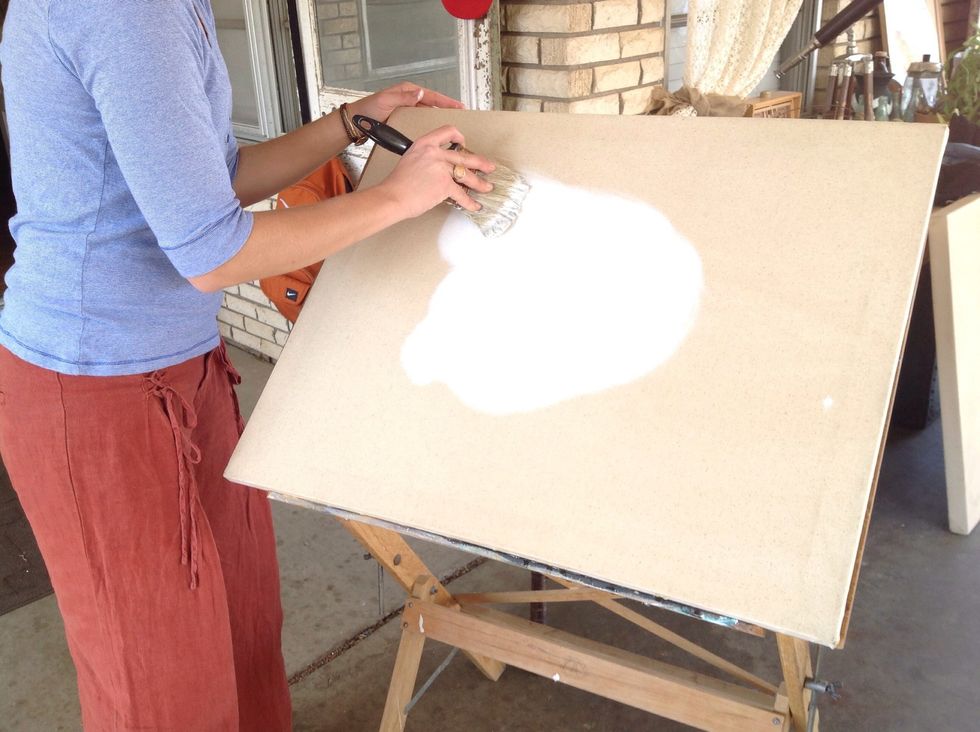 The thin layer of paint may soak in a little, but your ultimate goal is that the painting you apply later will not soak into the canvas.