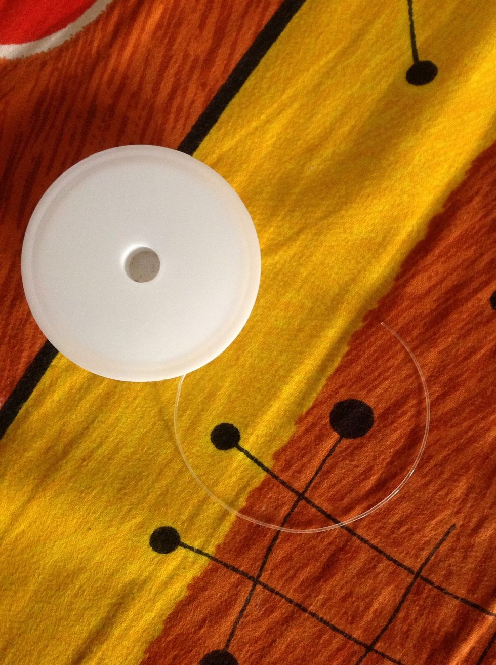 The thin transparent elastic, found easily at any craft store.