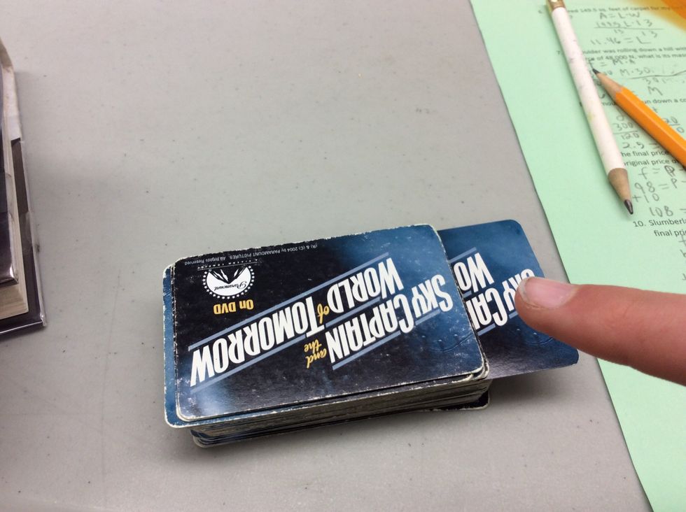 The third goes through a window in the third floor. Put this card 3/4 of the way up the stack.