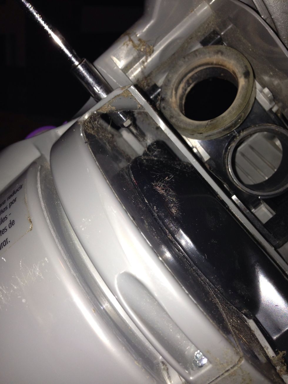 The third screw is tricky. It's hidden higher up and requires a long shaft.