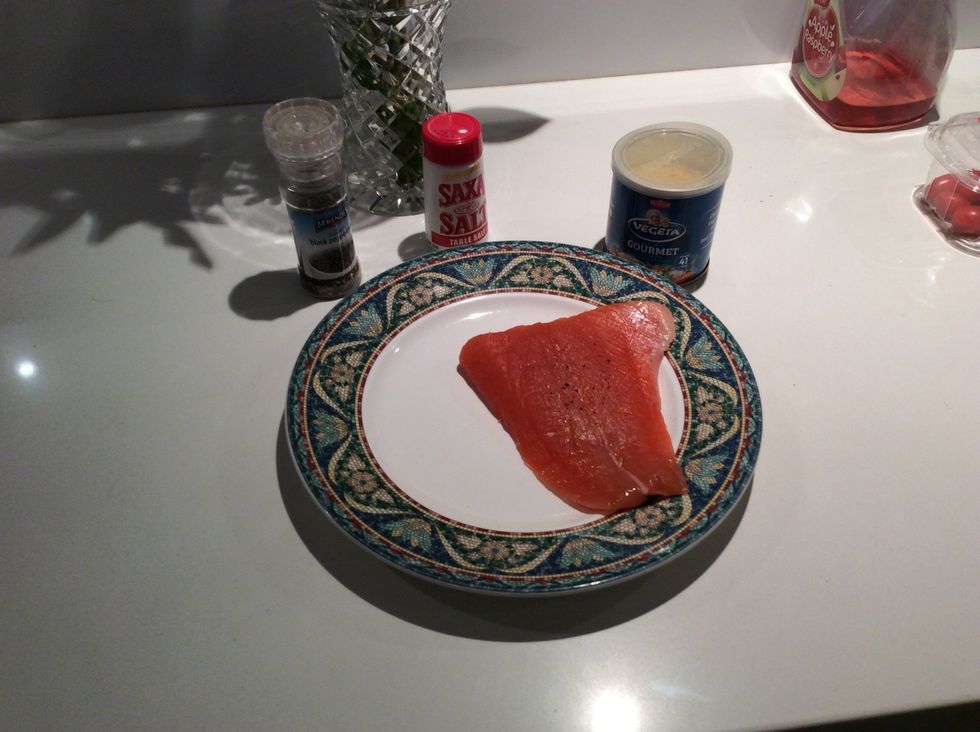 The third step is to rub salt, Vegeta and pepper into the salmon, this will add flavour