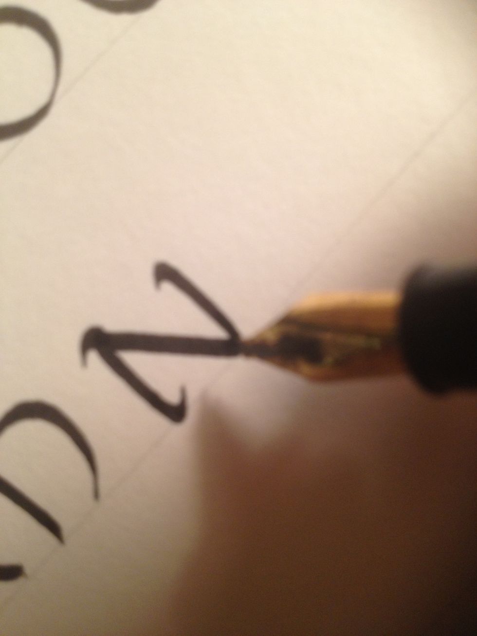 The third stroke curves as well, with a flourish to finish things off.