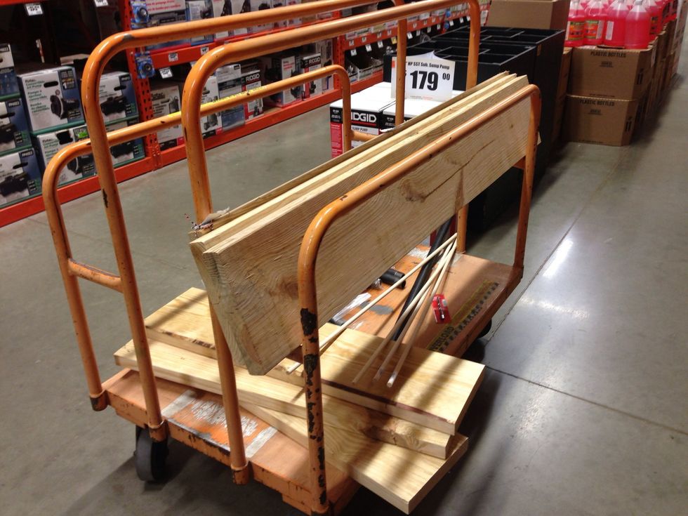 The three 2"x10"x8 foot cut down to (3) 5' planks by a Home Depot employee. (The planks laying flat are scrap that we can use later)