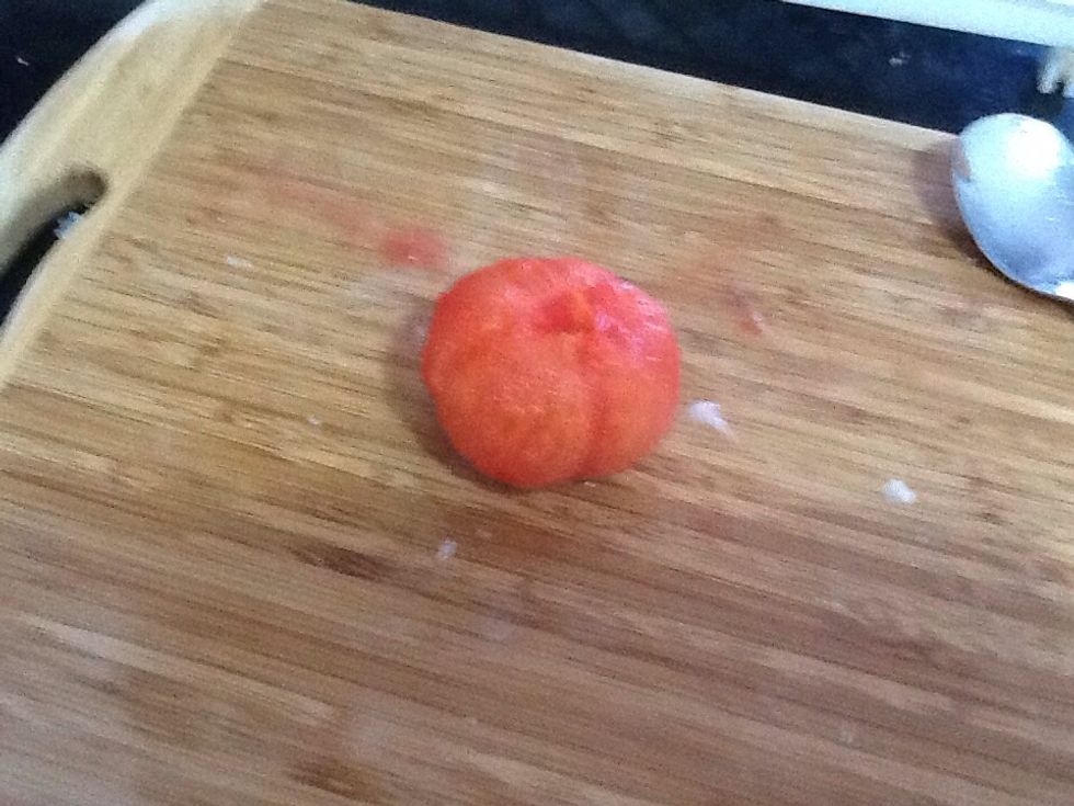 The tomatoes should be done now, so take them out and put them on the chopping board. Peel the skin, it should be very easy to peel. I recommend running it under cold water as it will be VERY HOT.