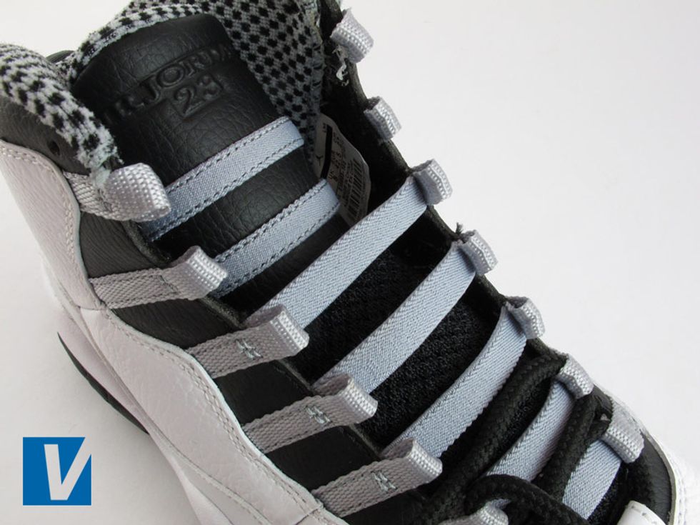 The tongue of new Jordan 10's has elasticated straps for added support at each lace loop, stitched directly onto the shoe. Check that these elasticated straps are taught.