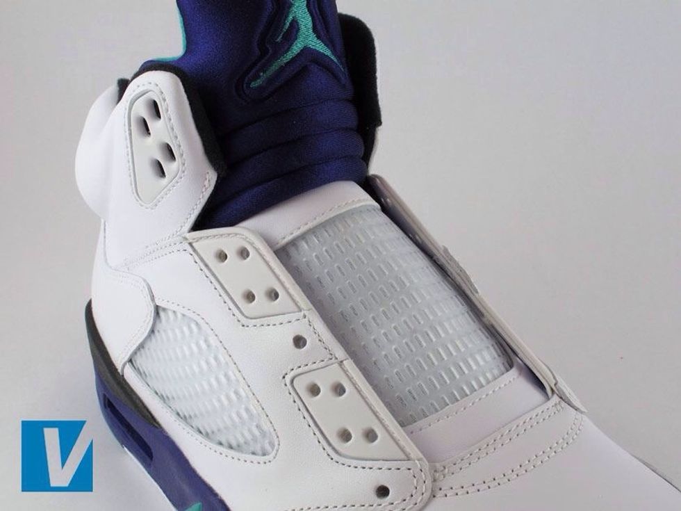 The tongue of new Jordan 5's is made of two parts. The lower section has mesh. The top section is a very different softer material and features an embroidered Jumpman logo.