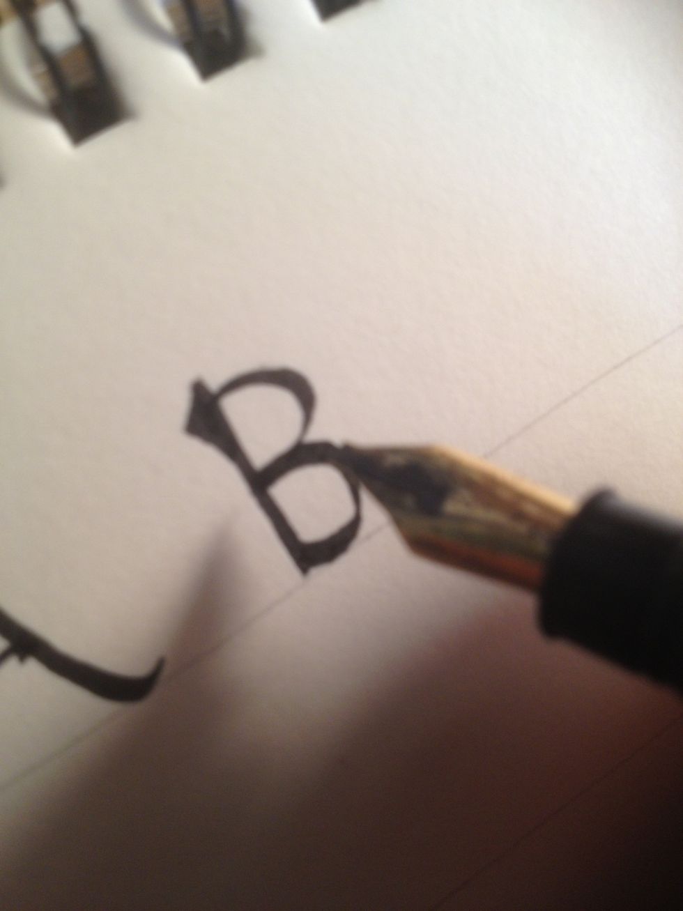 The top part of the letter should curve into the flat top of the lower half.