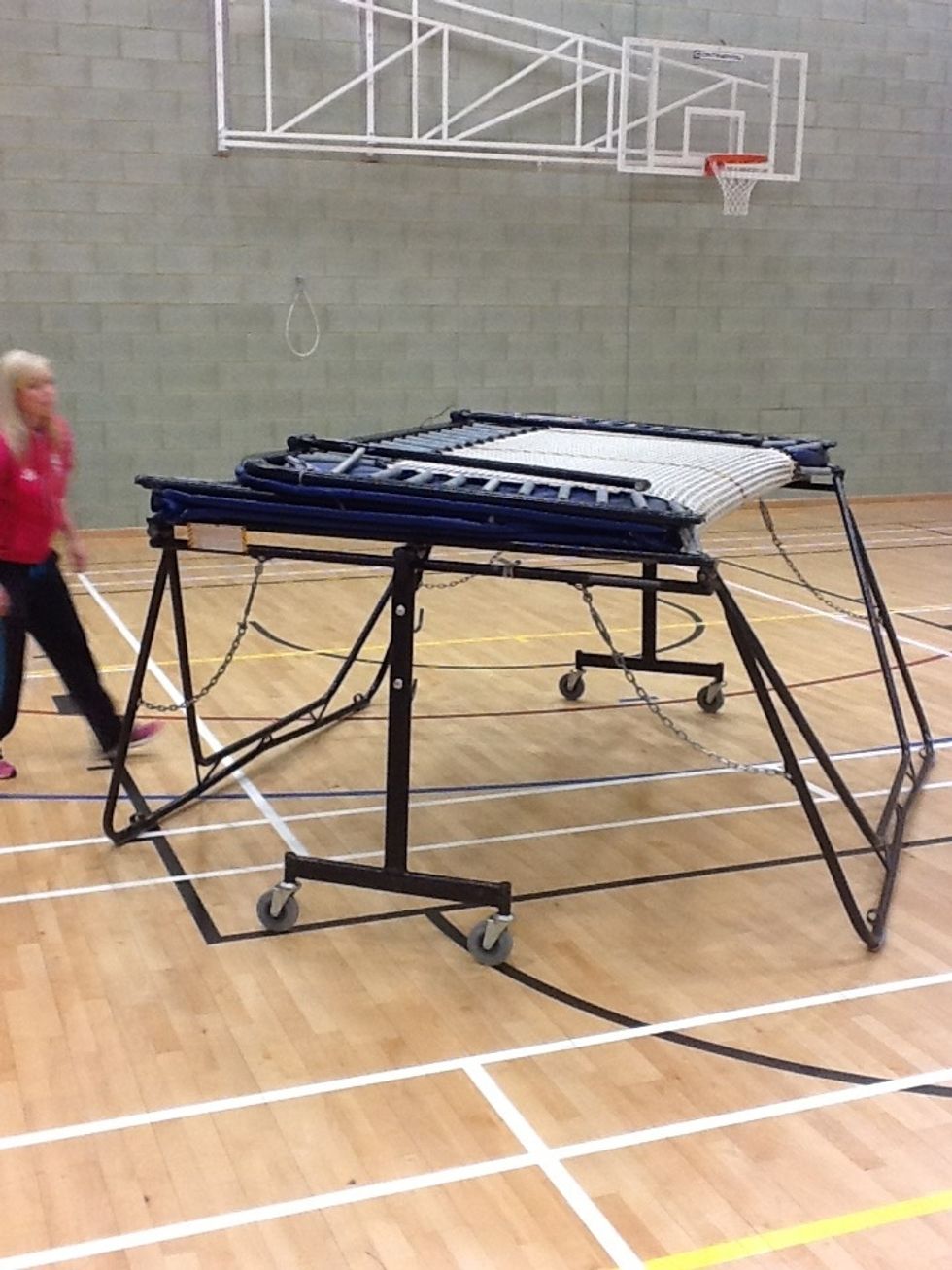 The trampoline will now be parallel with the floor. Make sure the legs are even on each side.