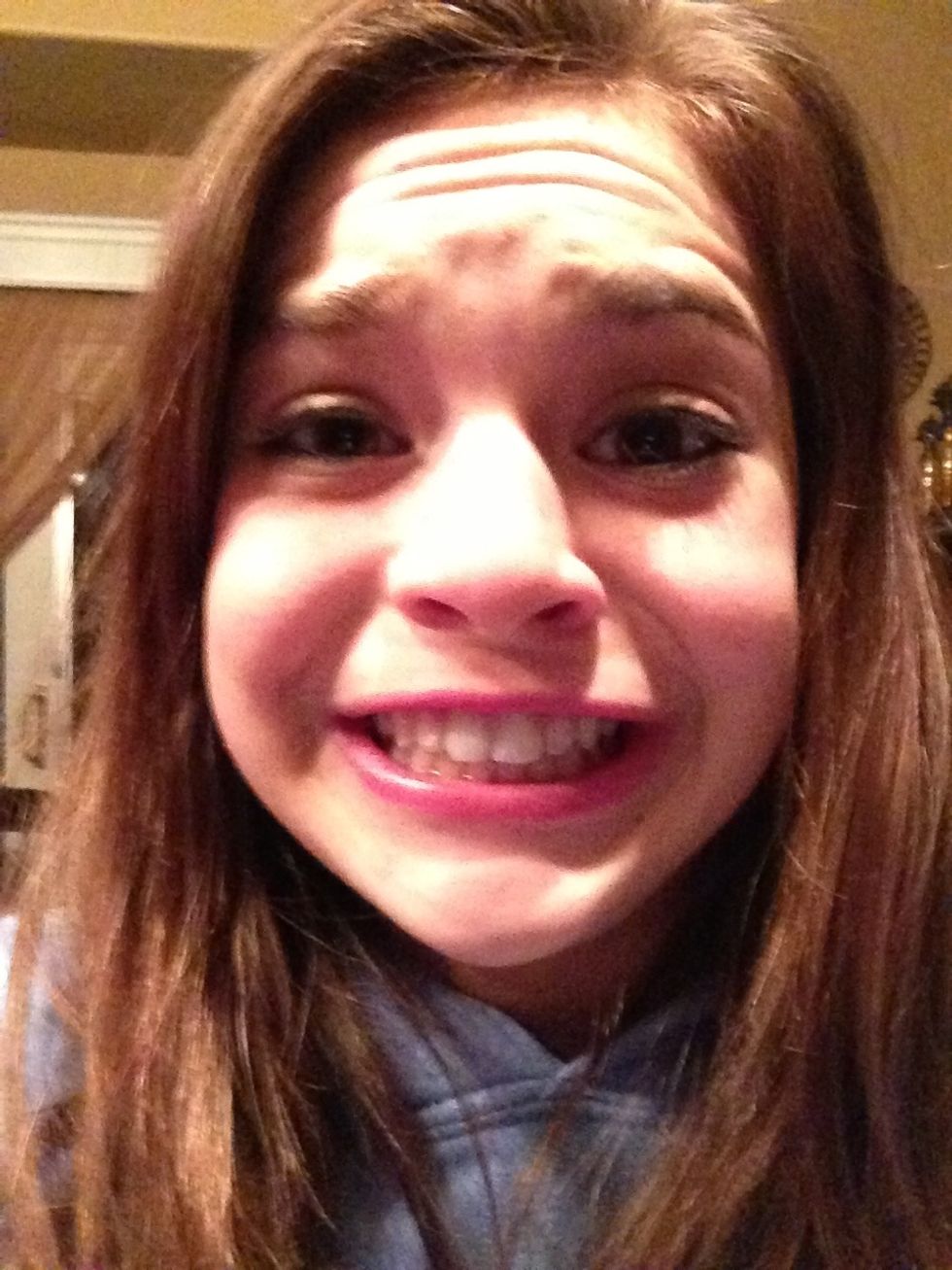 The "trying to smile but I'm too constipated " look