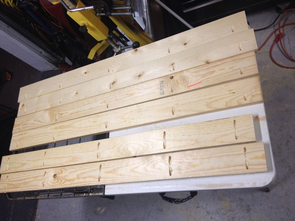 The two boards at the bottom have holes drilled on both sides because they will go in the middle of the 2 larger boards