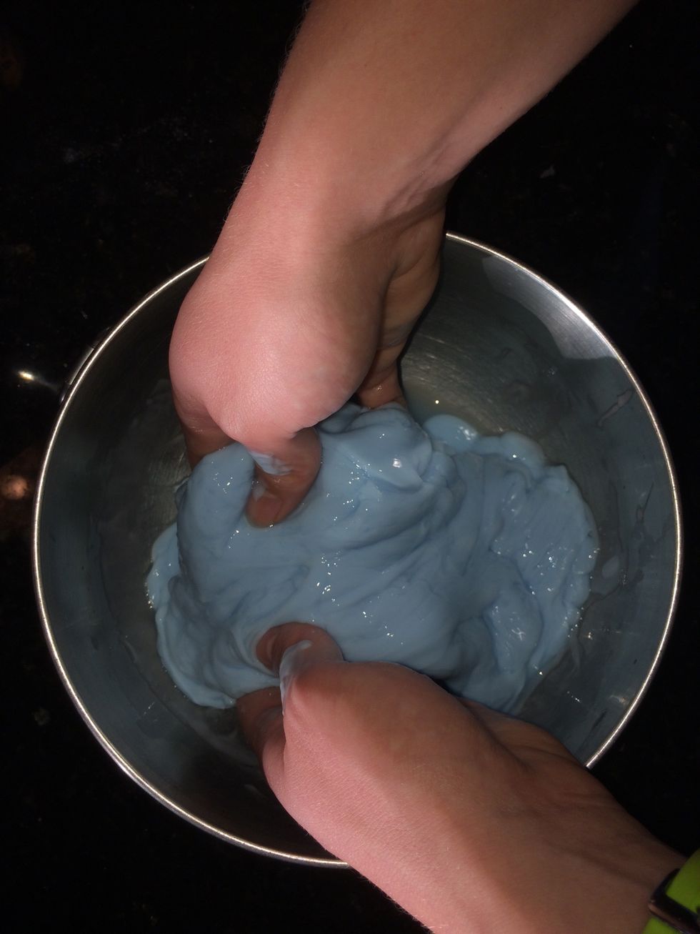 The two mixtures will begin to combine once added together, but continue to mix with your hands until they are completely mixed together.
