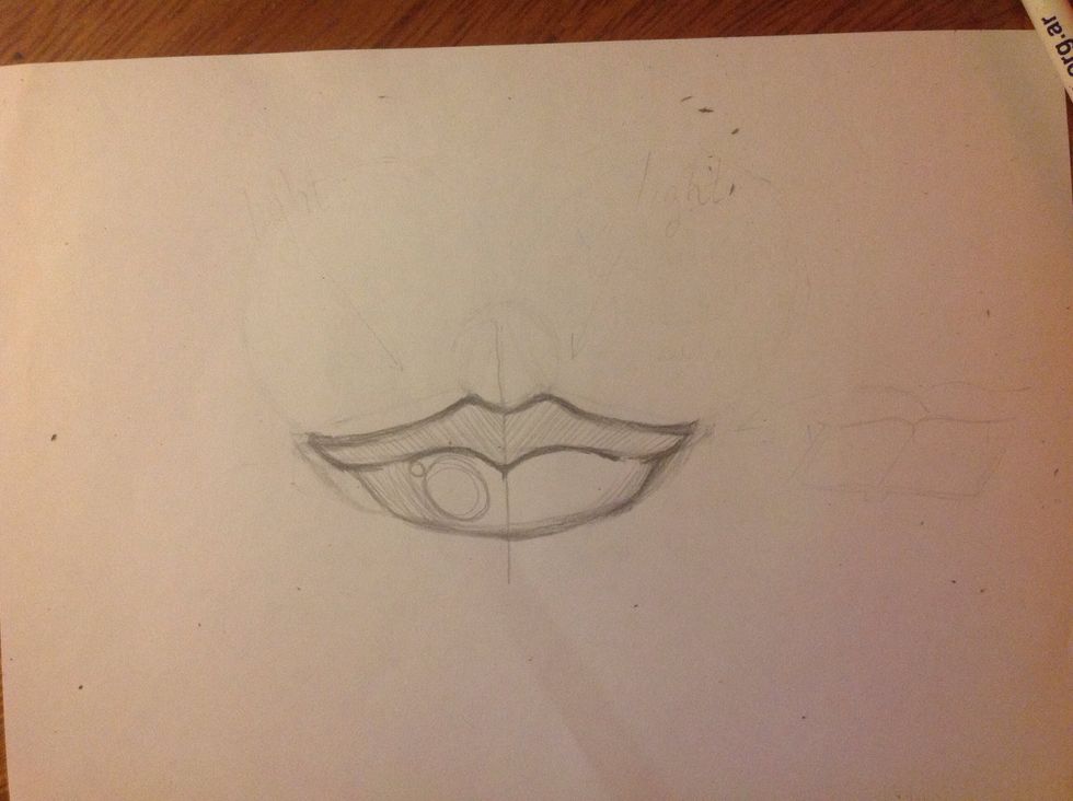 The upper lip is darker than the bottom one because the light is not direct. The brightness is in the lower lip, at the right. Remember, the light come from the up to the right.