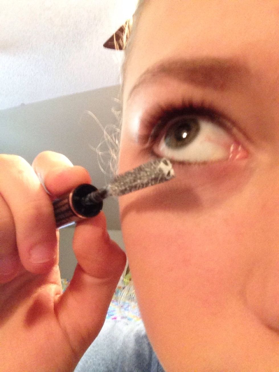The use mascara base on bottom and top lashes