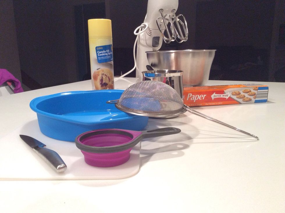 The utensils you will need are measuring cups of all sizes, a fruit knife, a chopping bored, a sieve, a cake tin, a saucepan, cooking spray, backing paper and an electric-mixer.