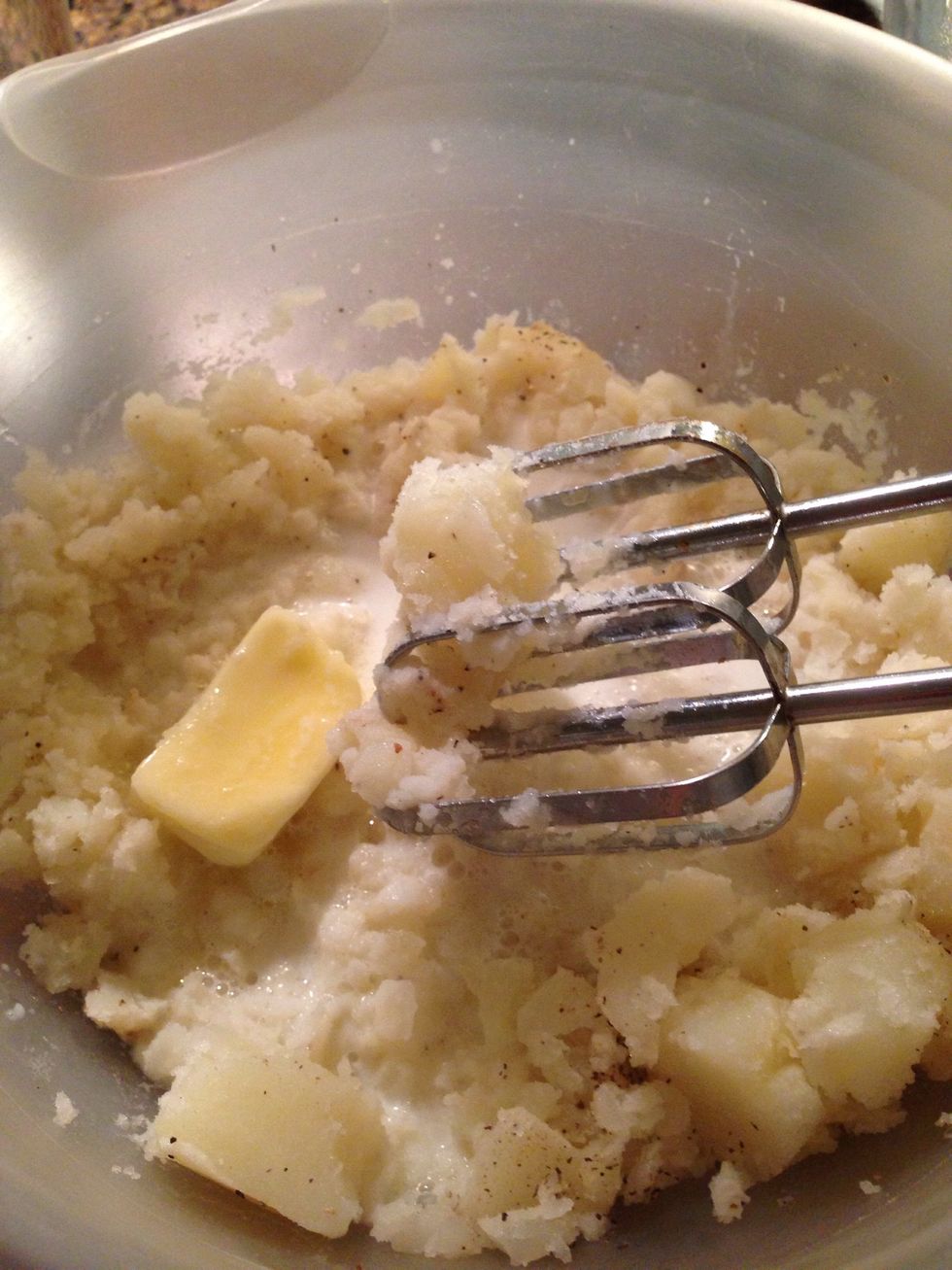 The warm milk and softened butter help with the creaminess of the final product. Use a mixer and blend blend blend!