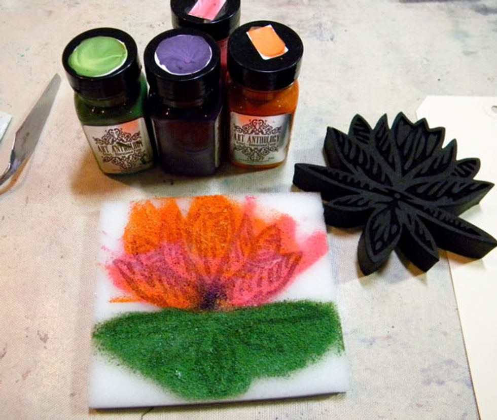 The water lily is my favorite! Apply Shamrock to the lower leaves, Persimmon and Tango on the upper leaves. Add a bit of Mardi Gras in the center. I used a key card to spread the mediums around.
