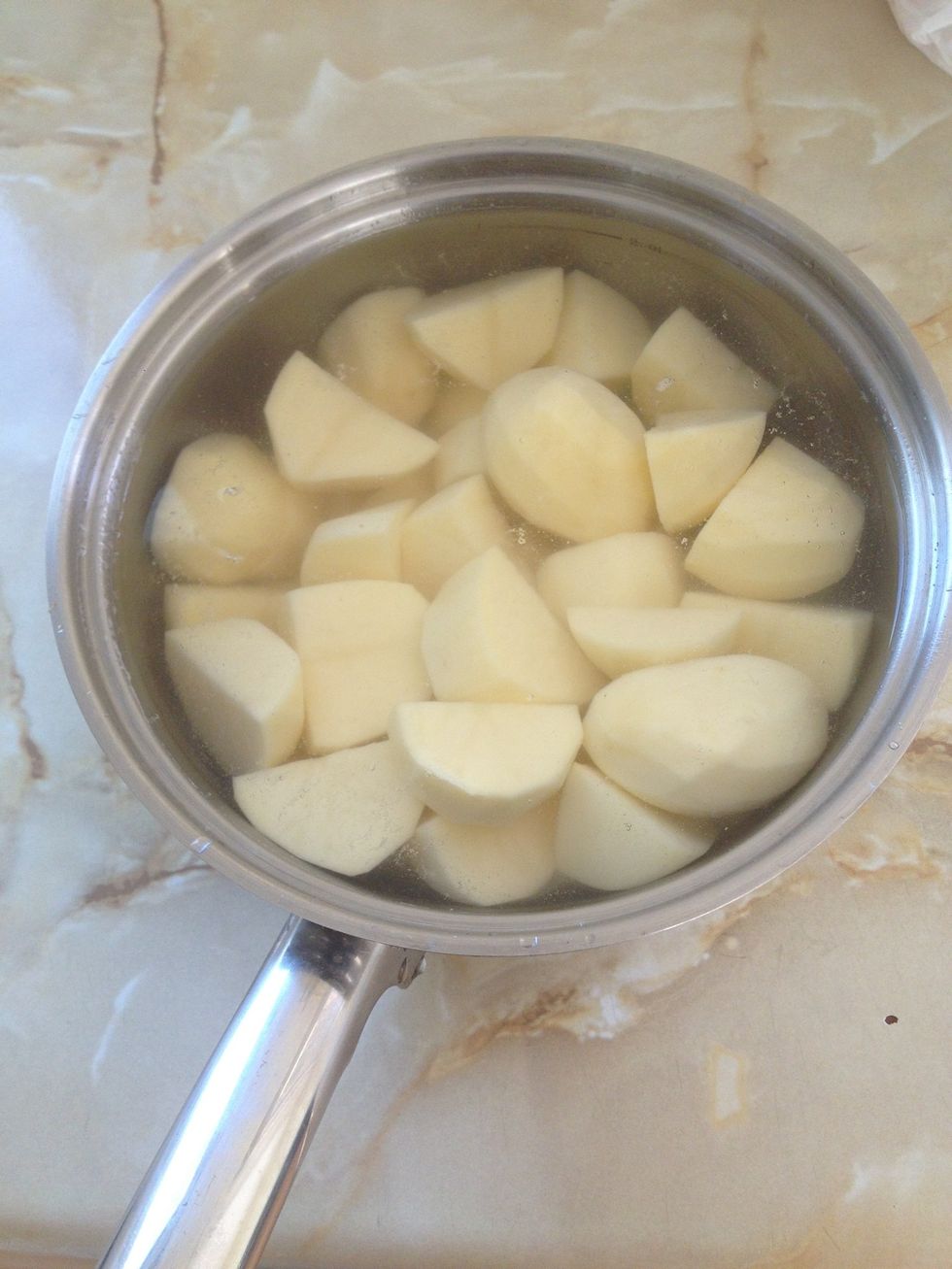 The water will be cloudy this is the starch from the cut potatoes, rinse out about two or three times till the water is clear