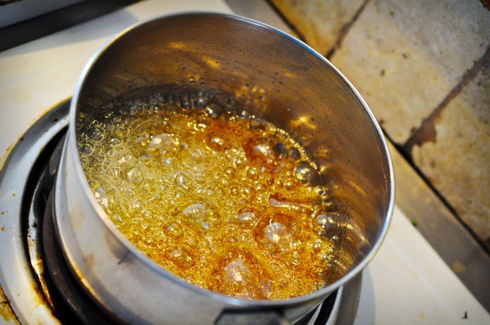 The water will eventually evaporate off, leaving just liquified sugar. Watch it as it bubbles away\u2014it will start to change colours to a characteristic caramel brown.