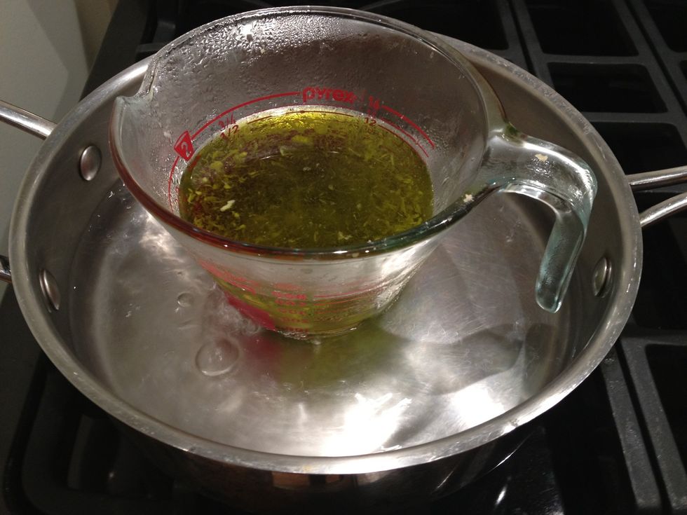 The wax and oils will slowly melt and combine. Don't cover with a lid while heating, as it will create condensation, which can ruin the salve. It's ok if condensation gathers on the outside.