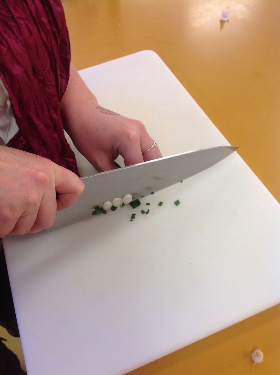 The white and the light green part of the scallion will be saut\u00e9ed and save the green parts of the scallion for garnishing the top of the cucumber appetizer.
