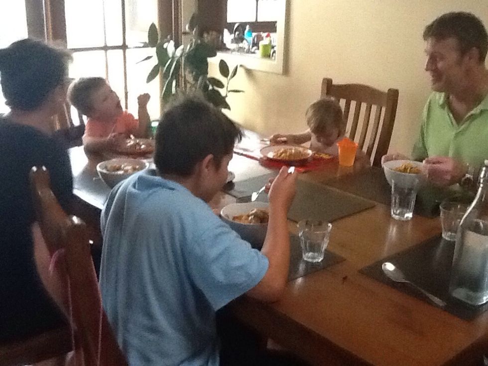 The whole family enjoying the meal.