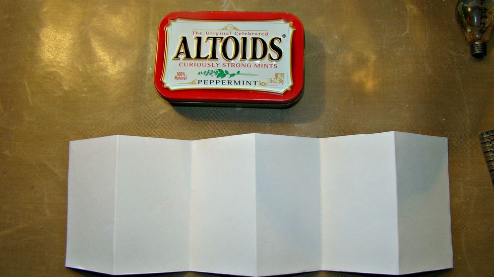 The width of the tin was a bit over 2 .25" so I folded my sections in 2" increments which provided 6 little canvases on either side.