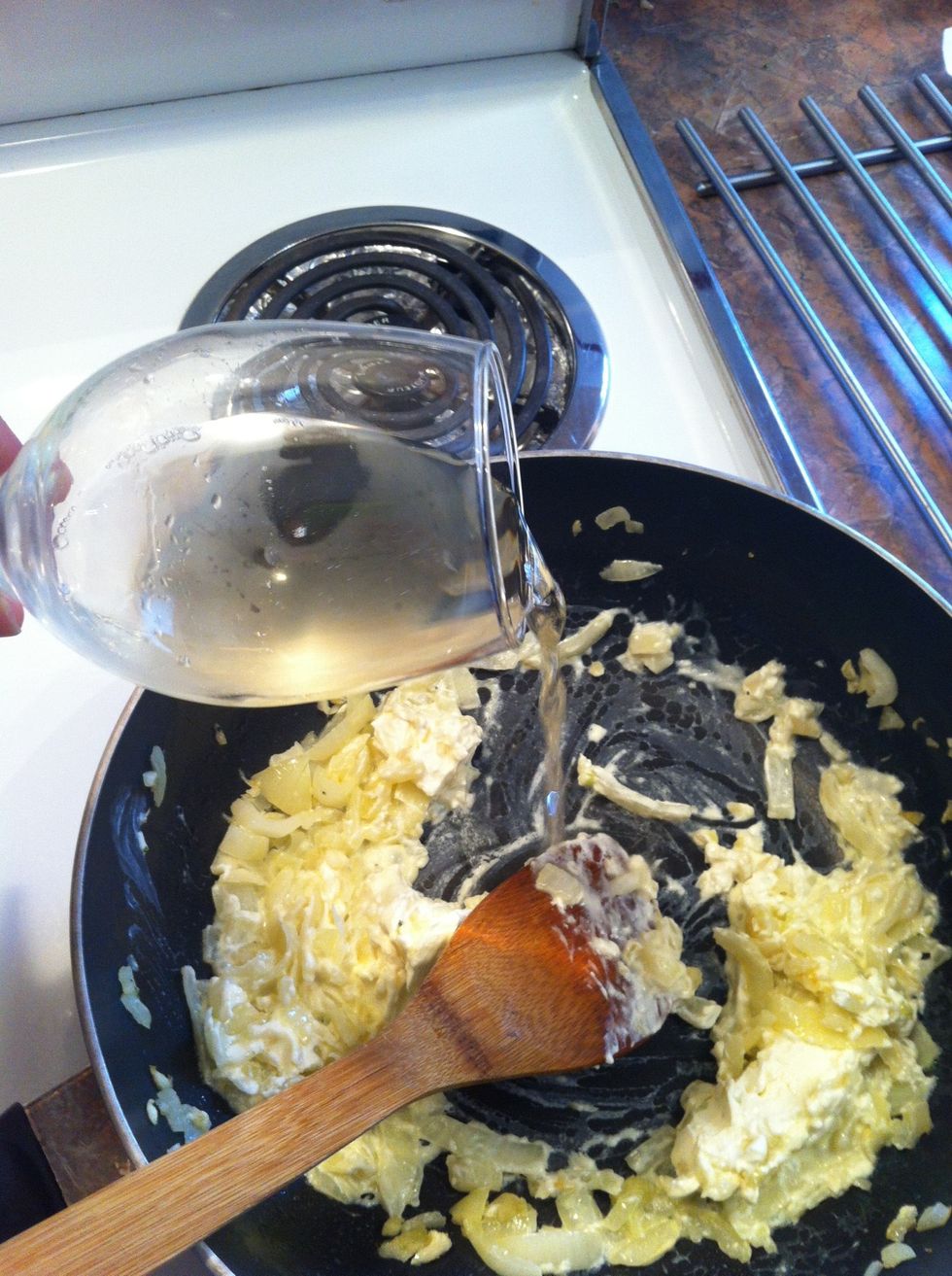 The wine smooths out the cheese. (beer and milk are also alright....broth too)