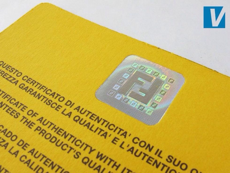 The yellow side of the guarantee card features a Fendi hologram. In position 2 the hologram should show the FF logos around the edge bright and clearly defined.