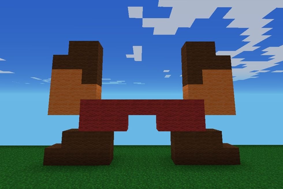 The you add brown wool again for the sleeves and orange wool for the hands