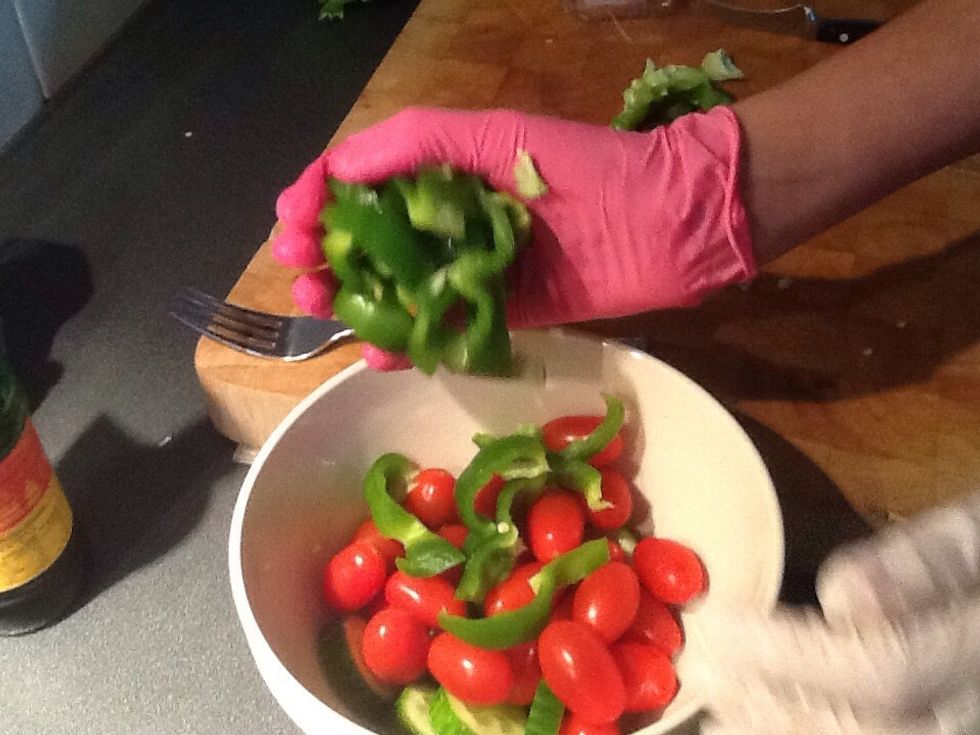 Them you place the sliced capsicum in the bowl with rest of the ingredients