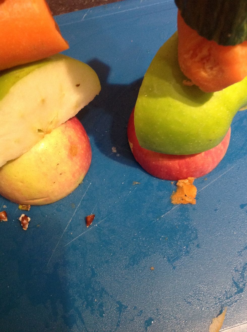 Then 1/2 of a small red apple and then push all of the fruit to the bottom but don't let it fall off!