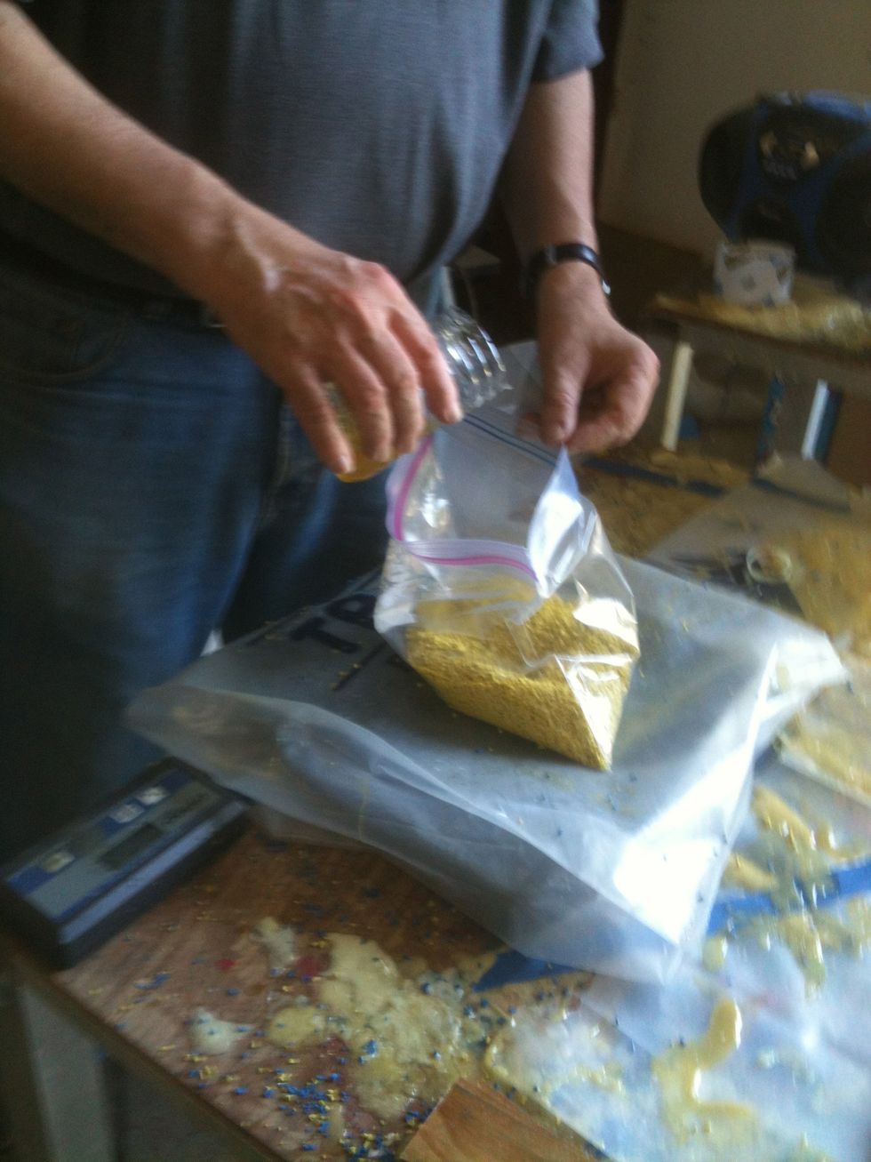 Then a very thin layer of binder is applied to the surface. Spread the binder with a trowel. Next weigh rubber granules and binder. The exact ratio of granules to binder is very important.