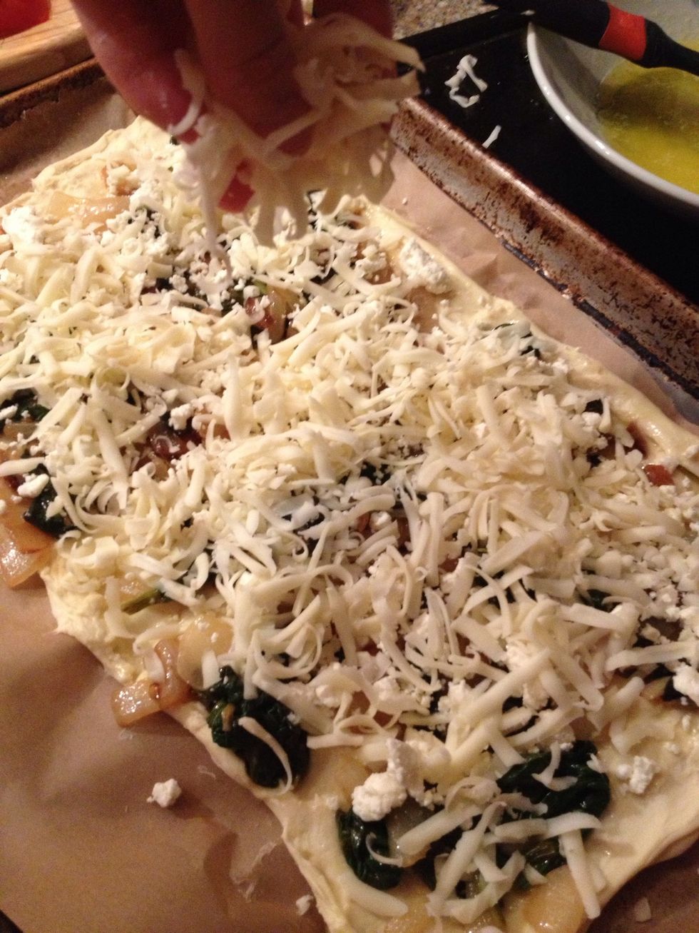 Then about half of the grated mozzarella.