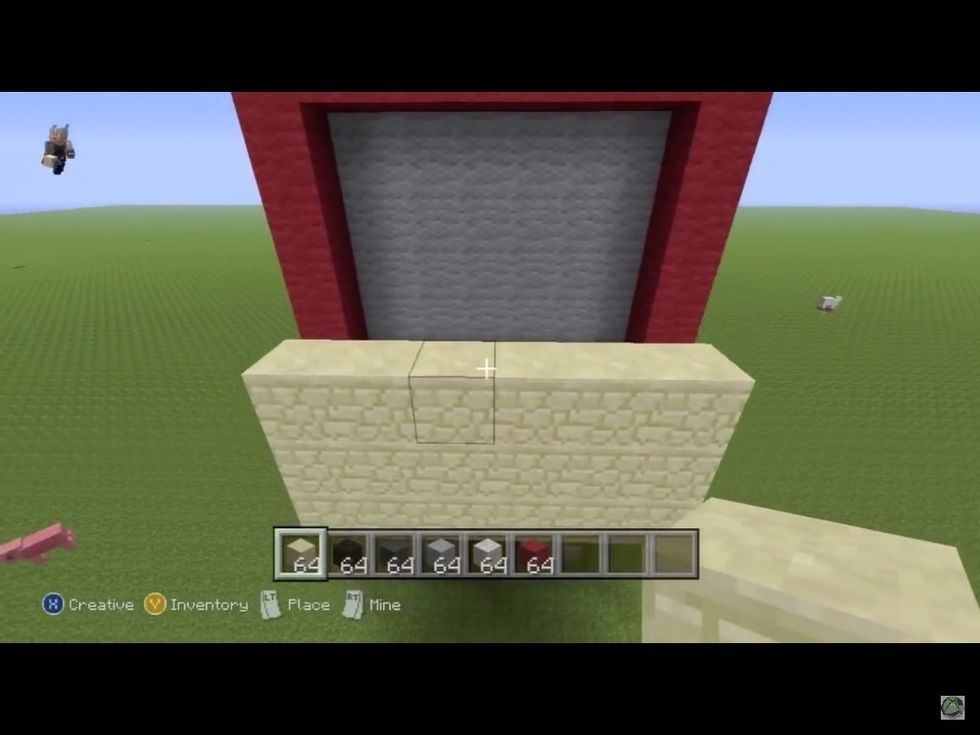 Then above the line of sandstone and grey wool place sandstone 2 blocks high