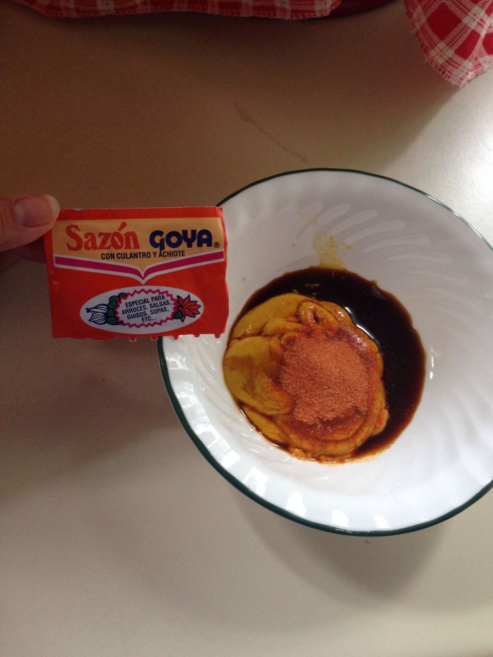 Then add 1 bag of of Sazon Goya that contains coriander and annatto. If you do not have this you can just add 1 tsp of all purpose seasoning, but I love the orange color the annatto gives the chicken.