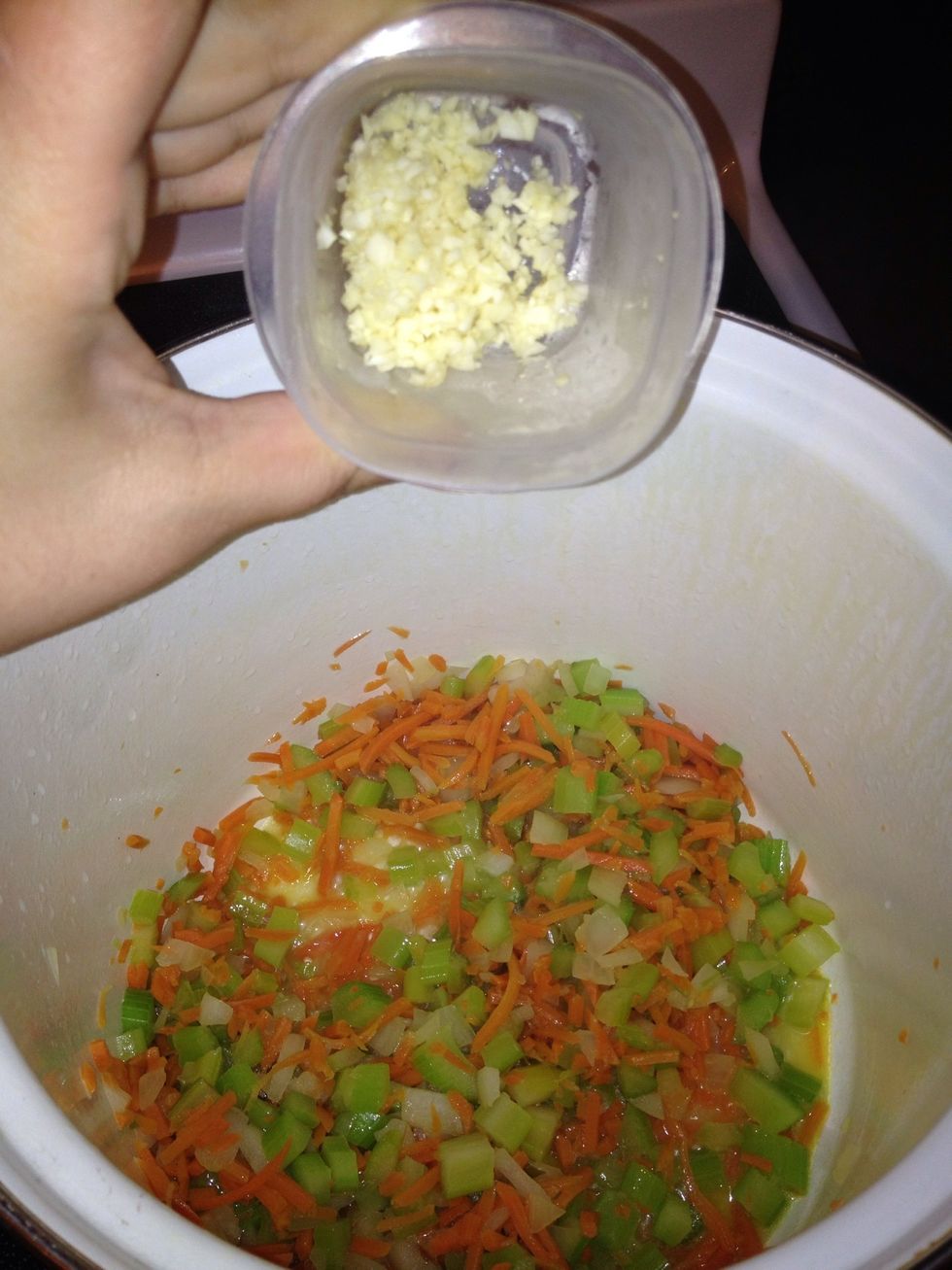 Then add 1 tablespoon of garlic and simmer about 2 minutes.