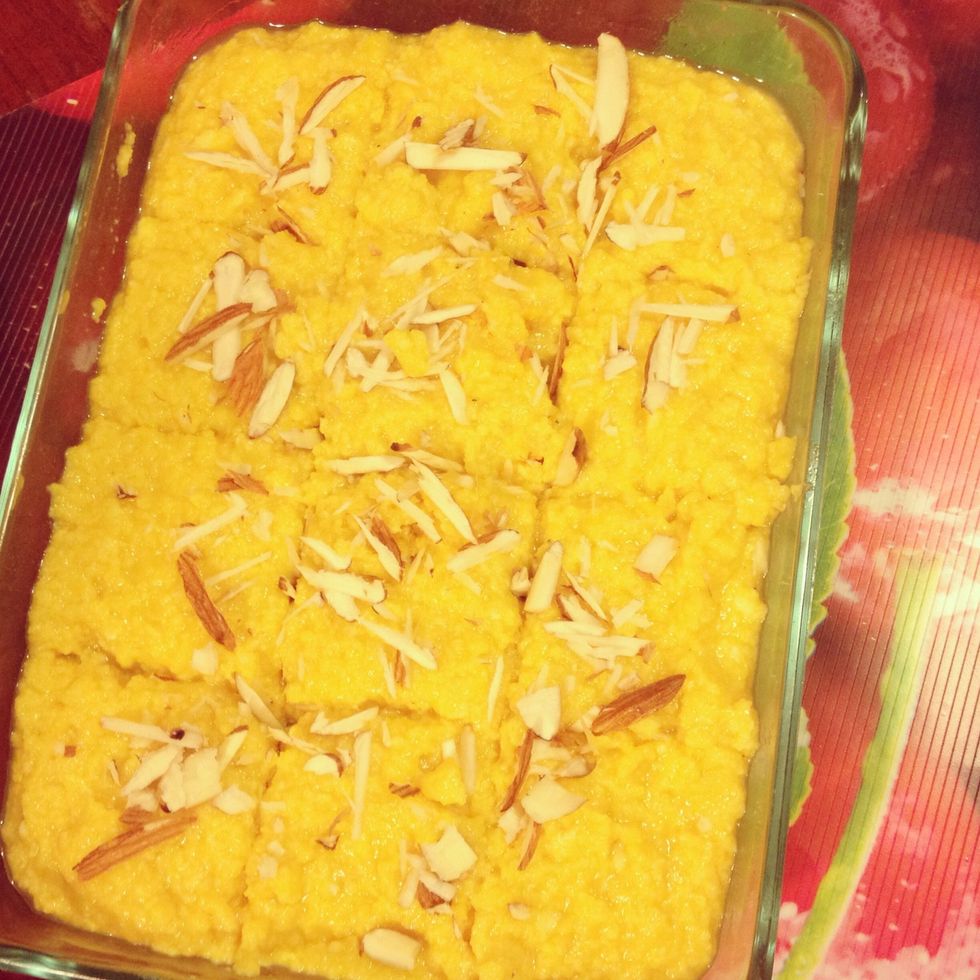 then add 2.5 cup crumbled Cottage Cheese (Homemade or store brought), 1 cup milk powder, 1 and half cup of Sweetened Condensed Milk. Mix all this well together and cook for 10 to 12 minutes.