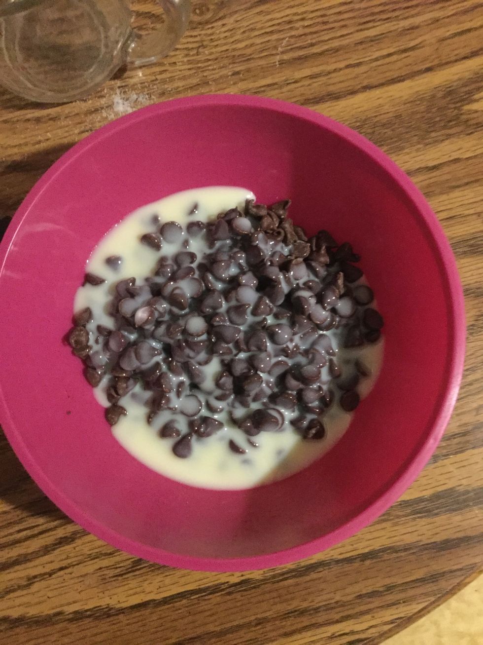 Then add 2 cups of chocolate chips and 1 can of sweetened condensed milk into a bowl and put in the microwave at 20 second increments until melted.