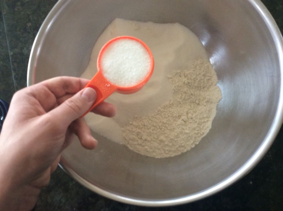Then add 2 cups of sugar. There is no need to use the dipping method here but do level the sugar off before placing it in the large mixing bowl