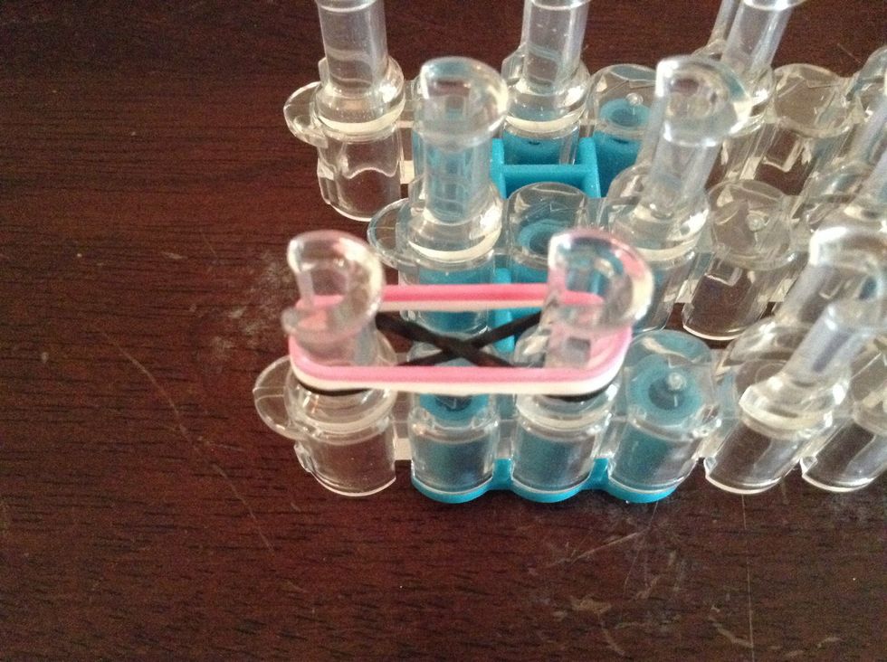 Then add 2 more rubber bands on top of it