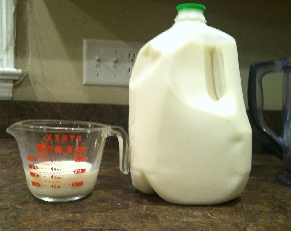 Then, add a 1/2 cup of milk into the blender.