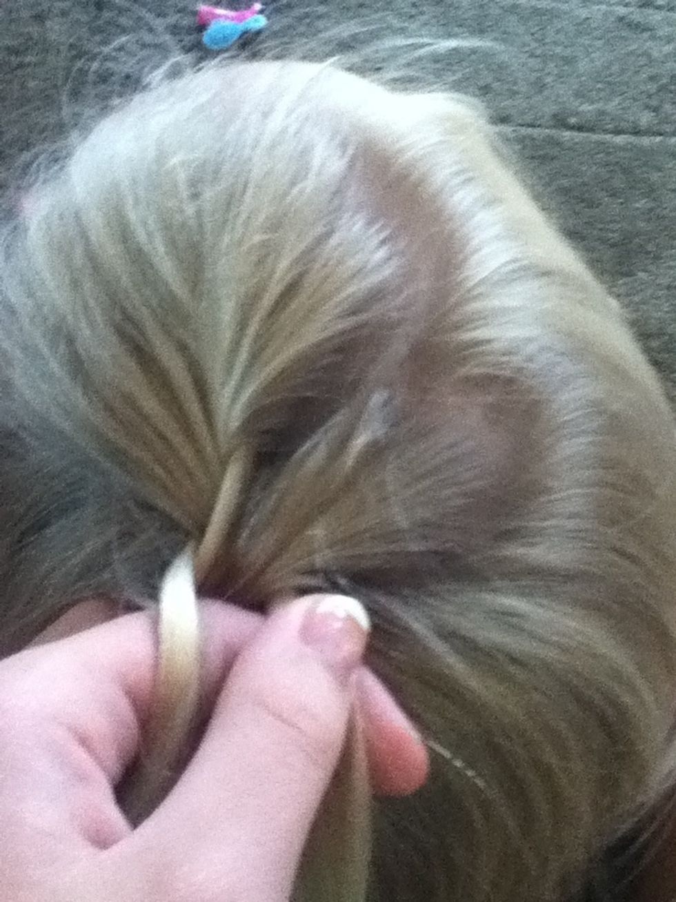 Then add a little piece of hair to the left side then cross over.