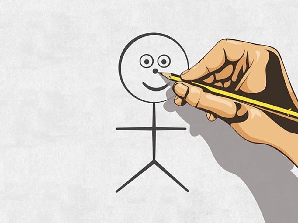 Then add a nose in the middle so draw a dot in between the mouth and the eyes