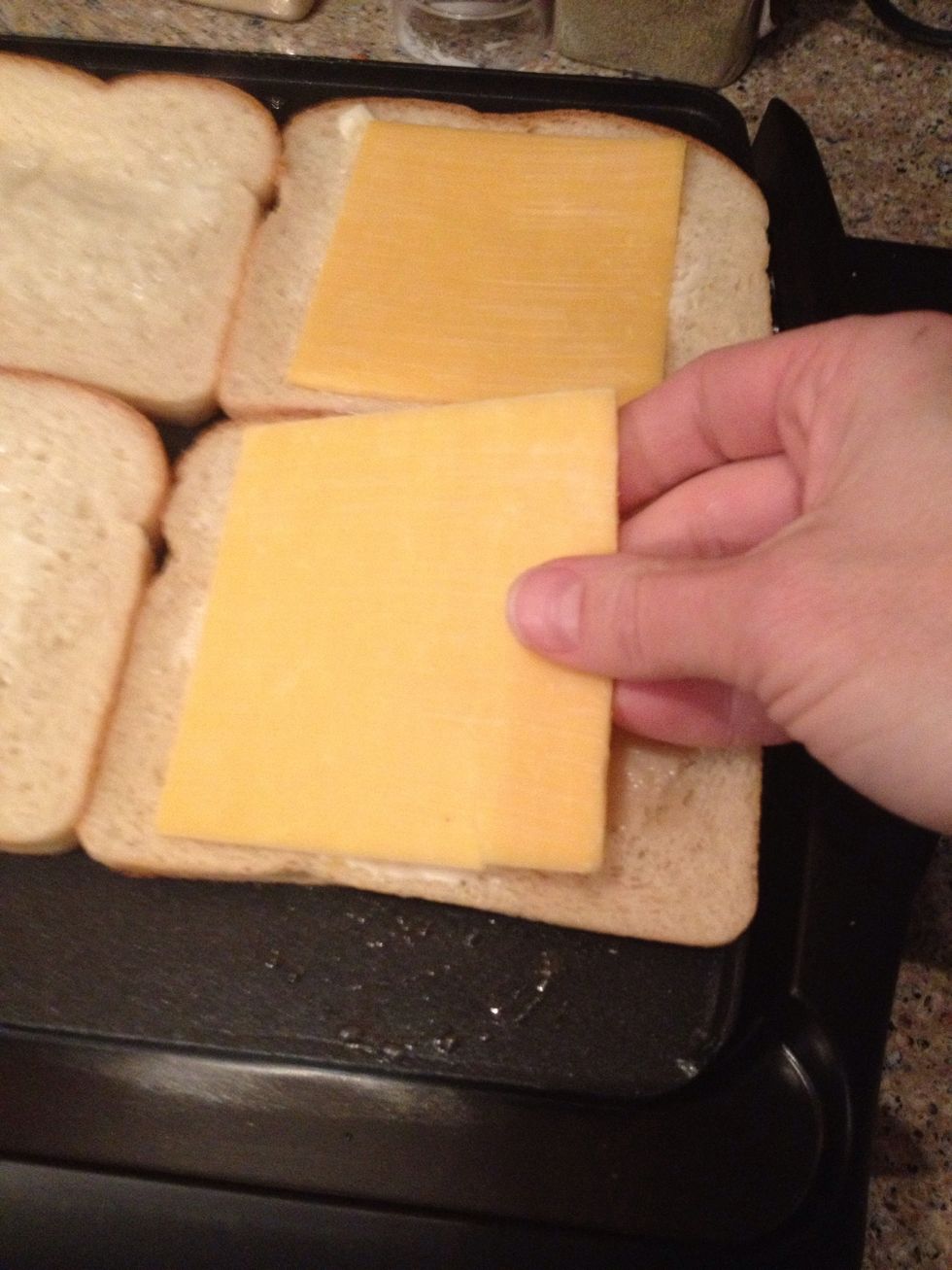 Then add a slice of cheese to each slice...