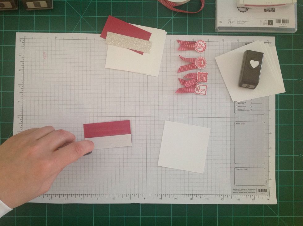 Then, add adhesive to the back of the cardstock and glimmer paper.