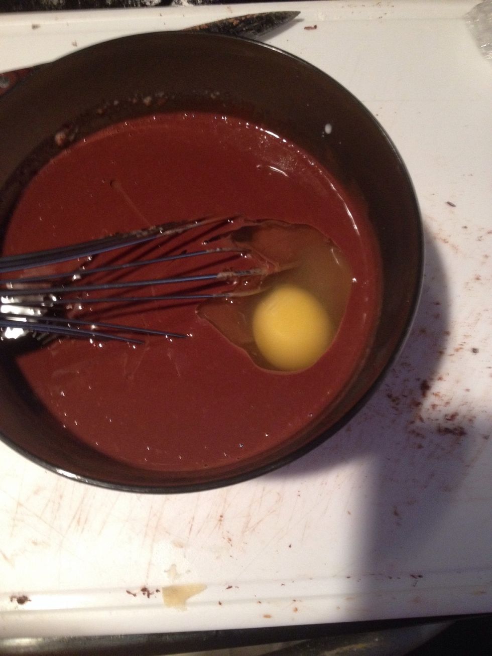 Then add an egg and whisk together