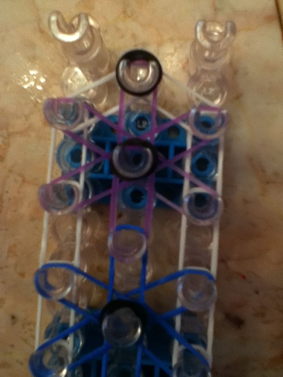 Then add another band to the top peg of the purple band
