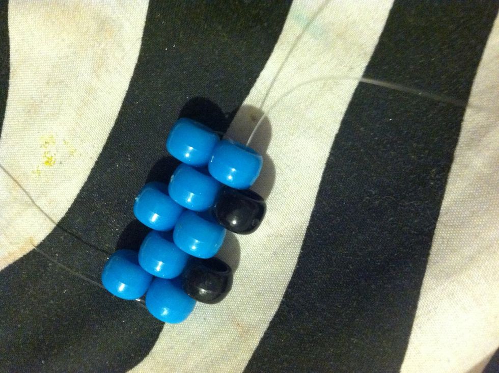 Then Add Another Black Bead Ad String It Through .