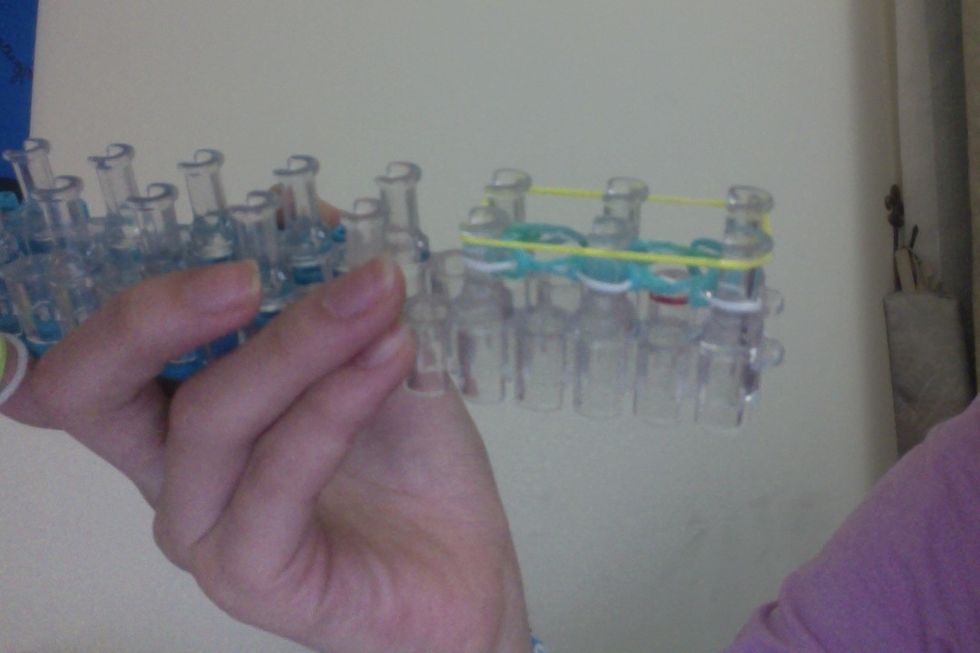 Then add another rubber band (yellow).